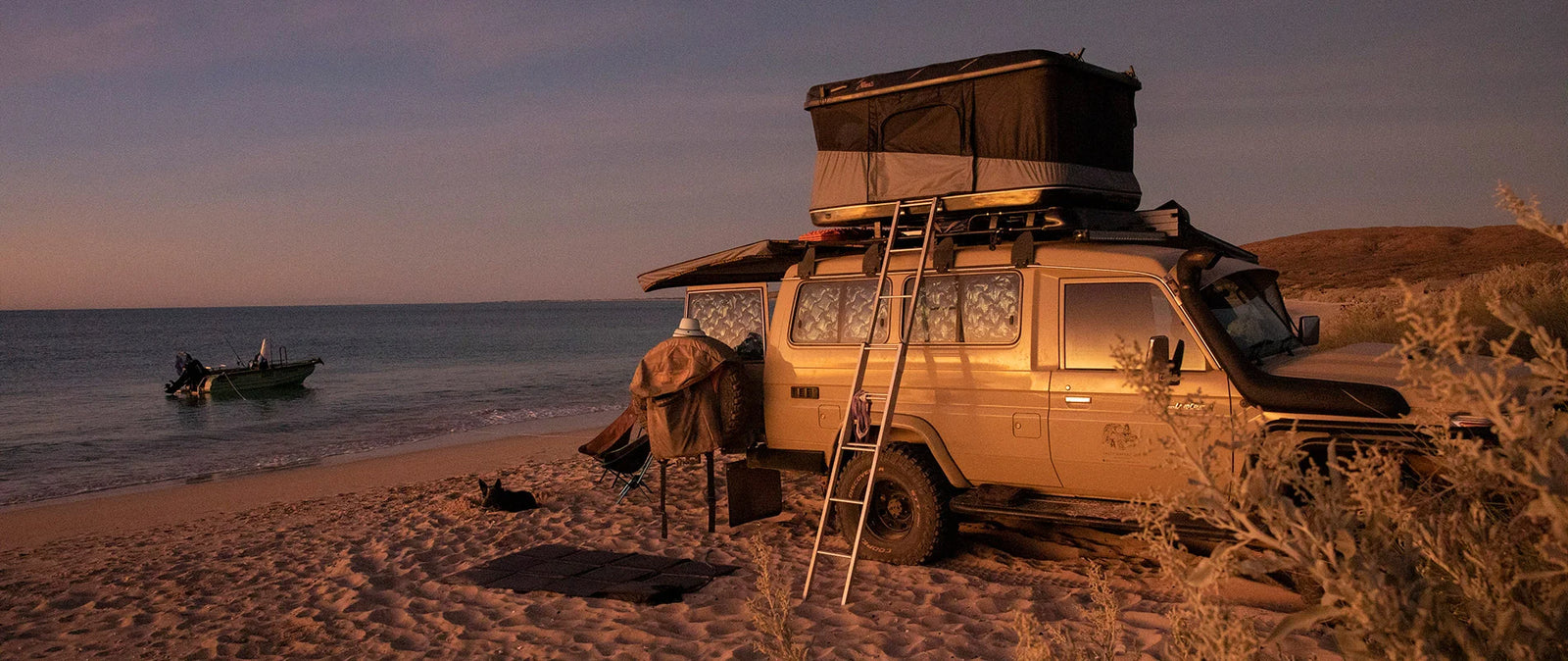 James Baroud Evasion roof top tent at a coastal campsite